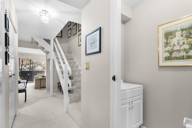 stairway featuring carpet and baseboards