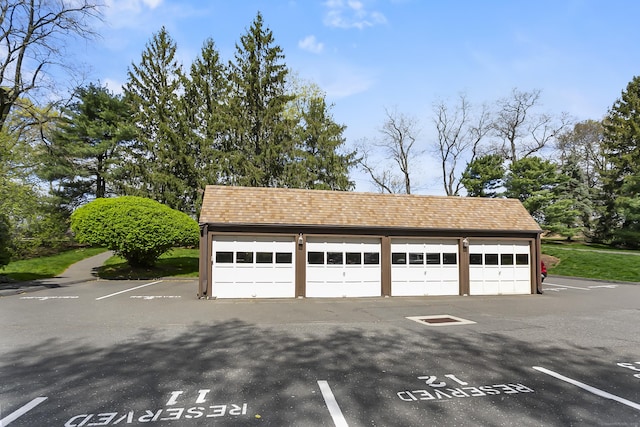 garage featuring uncovered parking