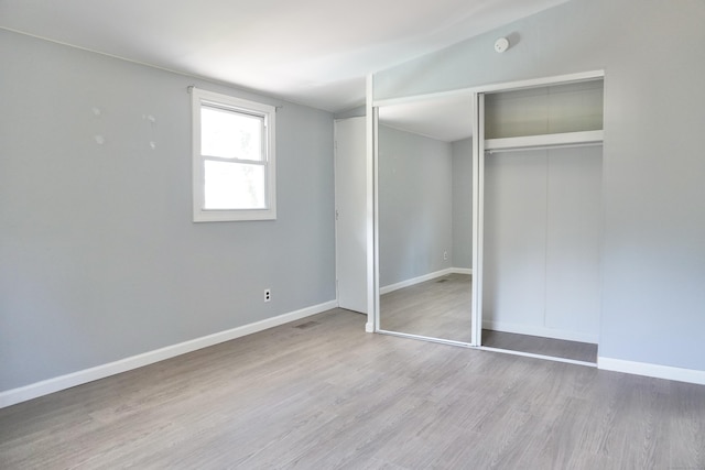 61 Forest St, Naugatuck, CT 06770 - unfurnished bedroom featuring wood finished floors and a closet