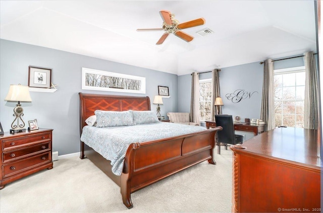 bedroom with multiple windows, light carpet, and visible vents