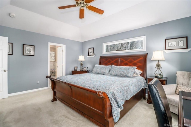 bedroom with connected bathroom, baseboards, light carpet, and ceiling fan