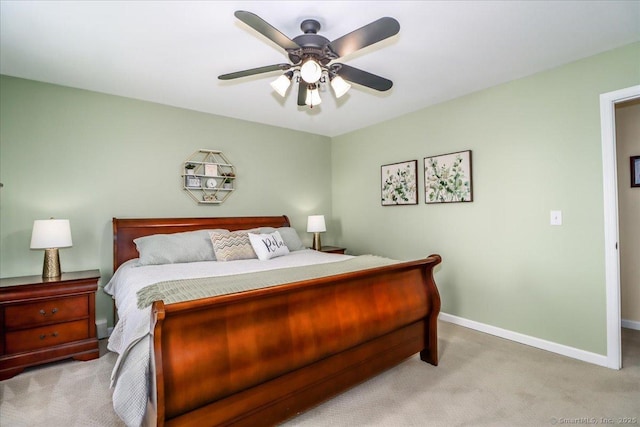 bedroom with carpet floors, baseboards, and a ceiling fan