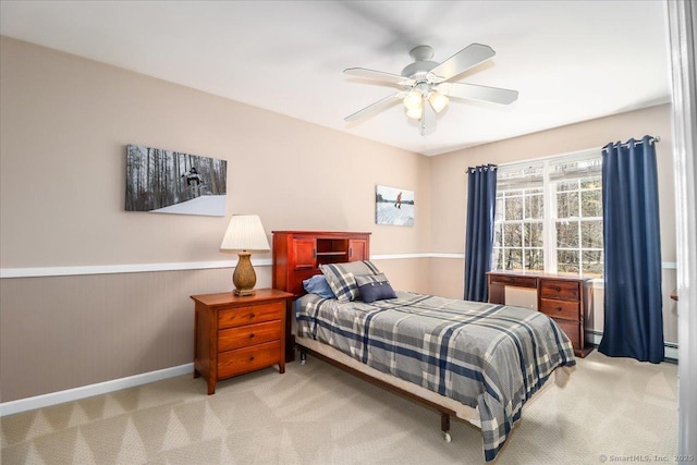 bedroom with baseboards, carpet, ceiling fan, and baseboard heating