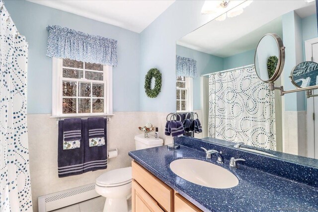 bathroom featuring vanity, curtained shower, toilet, tile walls, and a baseboard radiator