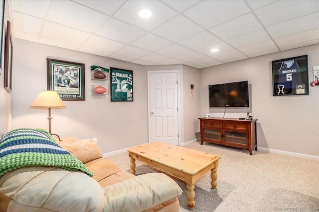 living room with carpet floors, recessed lighting, baseboards, and a drop ceiling