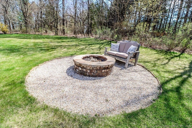 view of yard with a fire pit