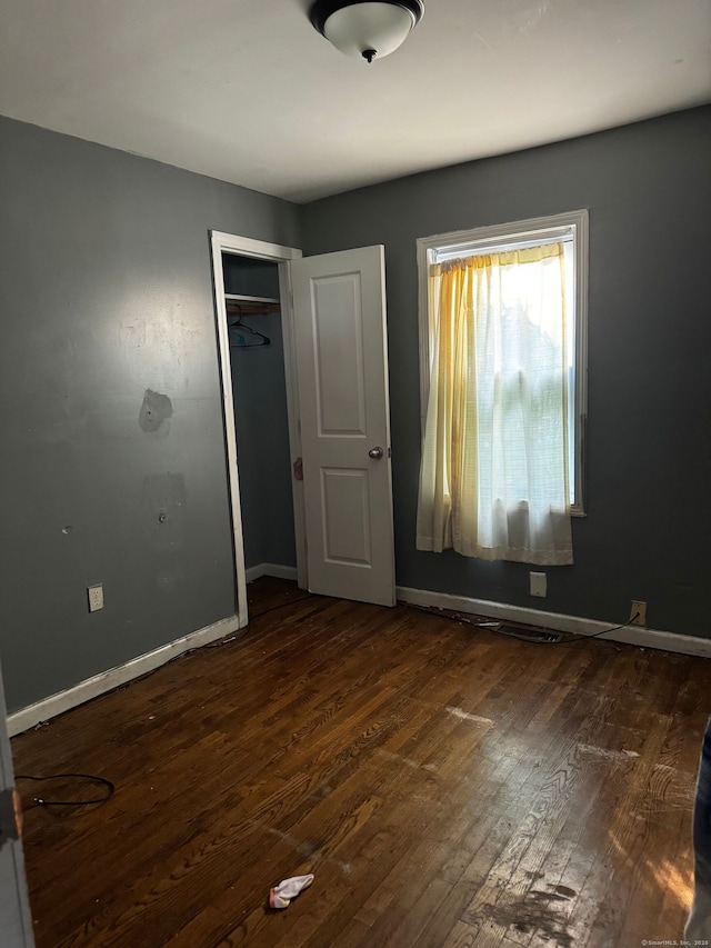 254 Starr St, New Haven, CT 06511 - unfurnished bedroom with dark wood-style flooring and a closet
