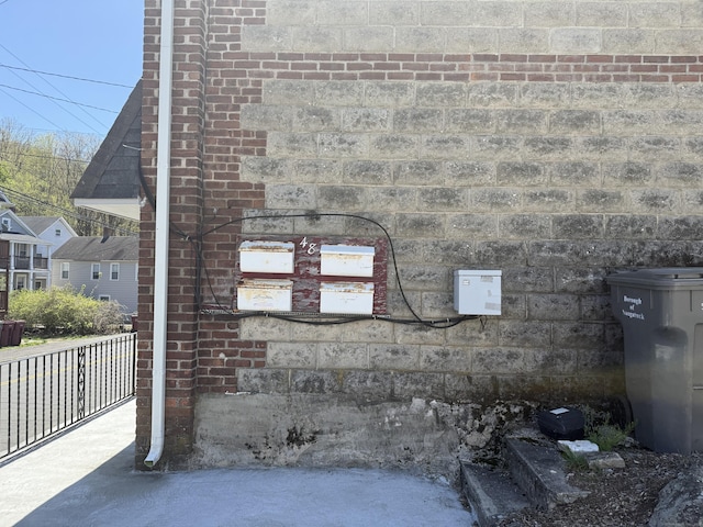 exterior details featuring brick siding