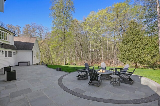 view of patio / terrace featuring an outdoor fire pit
