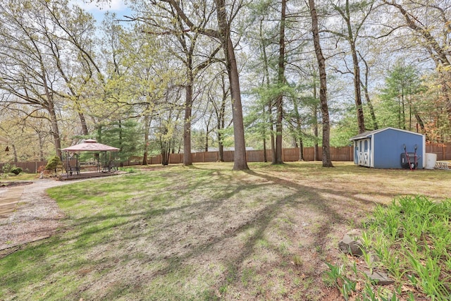 7 Sharren Ln, Enfield, CT 06082 - view of yard featuring a fenced backyard, a gazebo, a storage shed, and an outbuilding