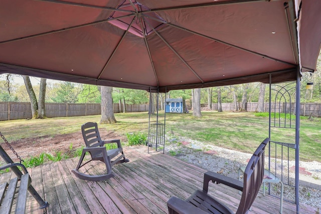 7 Sharren Ln, Enfield, CT 06082 - deck with a fenced backyard, an outdoor structure, a shed, and a lawn