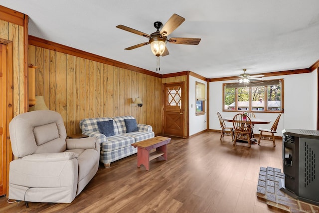 7 Sharren Ln, Enfield, CT 06082 - living area with crown molding, wooden walls, and a ceiling fan