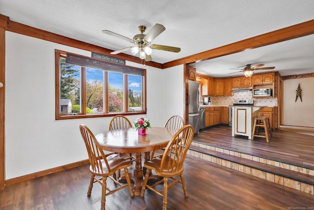 7 Sharren Ln, Enfield, CT 06082 - dining space with dark wood-style flooring, a textured ceiling, baseboards, and a ceiling fan