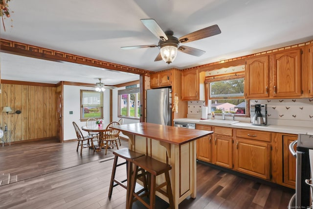 7 Sharren Ln, Enfield, CT 06082 - kitchen featuring a ceiling fan, a sink, dark wood-type flooring, baseboards, and appliances with stainless steel finishes