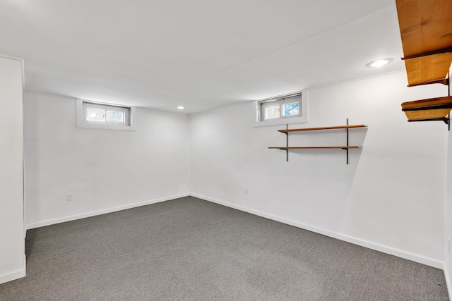 7 Sharren Ln, Enfield, CT 06082 - below grade area with baseboards, carpet flooring, and plenty of natural light