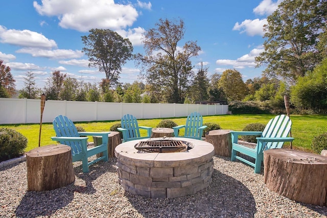 view of patio with a fire pit and fence
