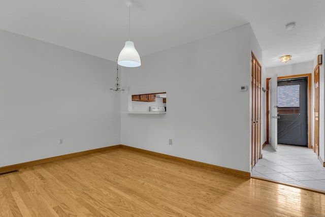 53 Cedar Knolls Dr Unit 53, Branford, CT 06405 - unfurnished dining area with light wood-style flooring and baseboards