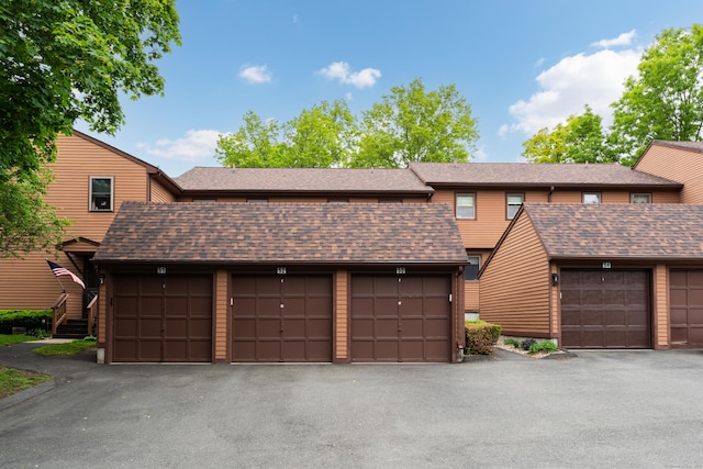 53 Cedar Knolls Dr Unit 53, Branford, CT 06405 - view of property featuring community garages and a shingled roof