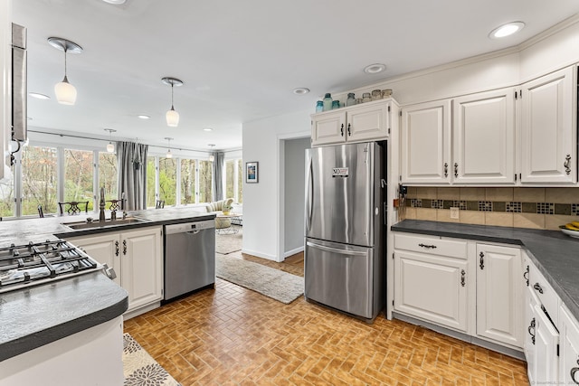 16 Howes Ln, Redding, CT 06896 - kitchen featuring appliances with stainless steel finishes, white cabinetry, dark countertops, backsplash, and decorative light fixtures