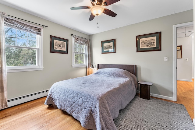 16 Howes Ln, Redding, CT 06896 - bedroom with wood finished floors, attic access, ceiling fan, and a baseboard heating unit
