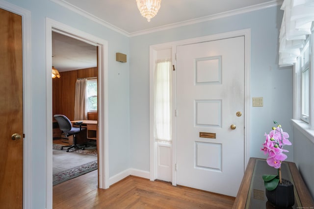 955 N Main St, West Hartford, CT 06117 - entrance foyer featuring a chandelier, crown molding, baseboards, and parquet floors