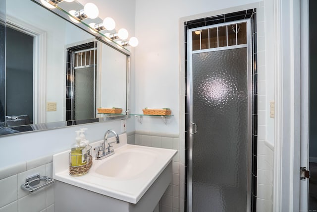 955 N Main St, West Hartford, CT 06117 - bathroom featuring a stall shower, vanity, and tile walls