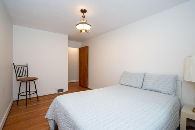 955 N Main St, West Hartford, CT 06117 - bedroom with wood finished floors and baseboards