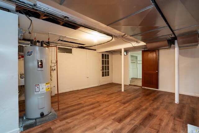 955 N Main St, West Hartford, CT 06117 - below grade area with electric water heater, wood finished floors, and baseboards
