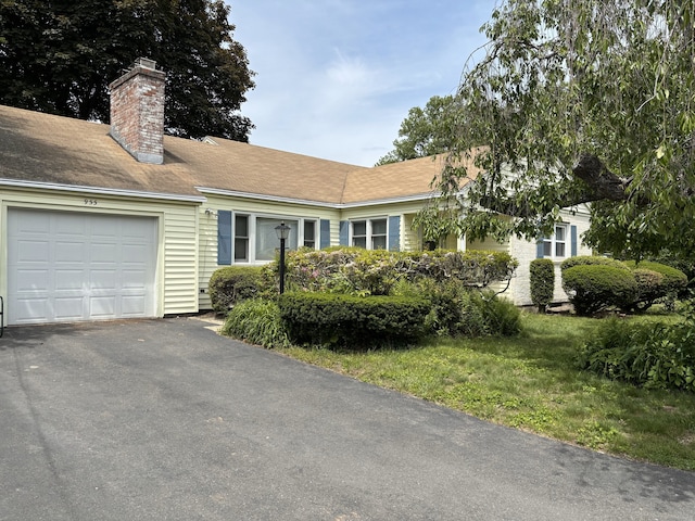 955 N Main St, West Hartford, CT 06117 - ranch-style home featuring a garage, a chimney, and driveway