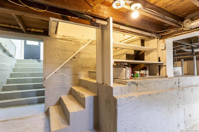 unfinished basement with stairway
