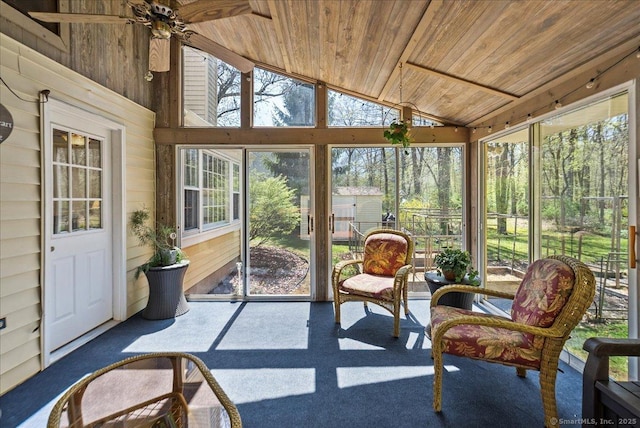 sunroom / solarium featuring ceiling fan