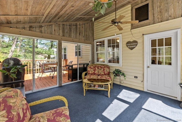sunroom with a ceiling fan