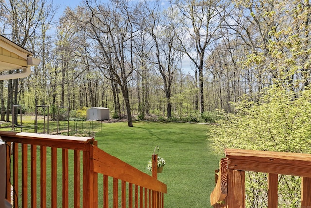 view of yard featuring an outbuilding and a shed