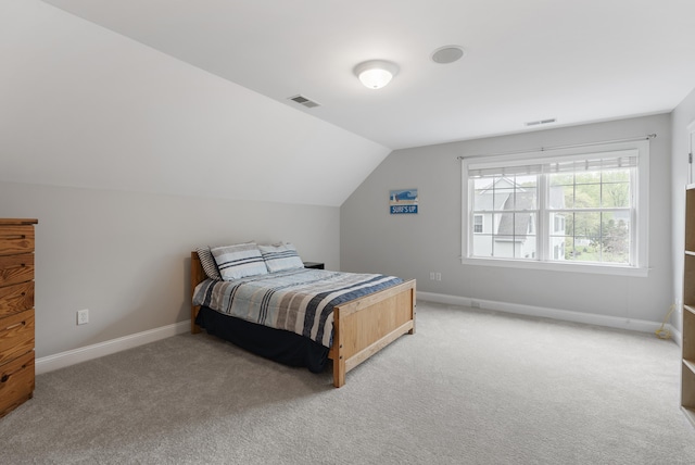 bedroom featuring light carpet, baseboards, and visible vents