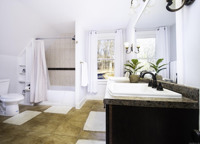 bathroom featuring double vanity, shower / bath combination with curtain, a sink, toilet, and a chandelier