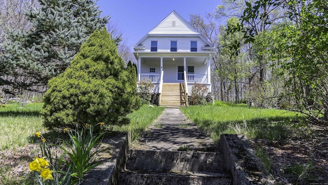 view of front of home with a porch and stairway