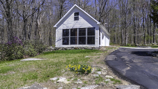 exterior space with a forest view