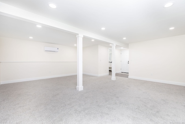 finished basement with recessed lighting, baseboards, a wall mounted AC, and light carpet