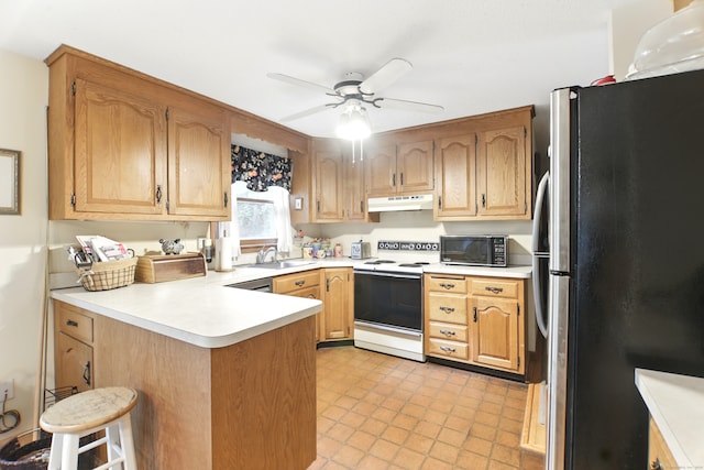 kitchen with freestanding refrigerator, white electric range oven, under cabinet range hood, a peninsula, and black microwave