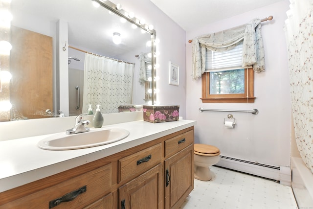 bathroom featuring baseboard heating, toilet, vanity, and tile patterned floors