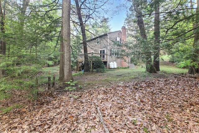 view of yard with a wooden deck