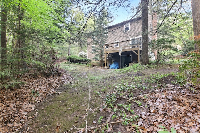 view of yard featuring a wooden deck