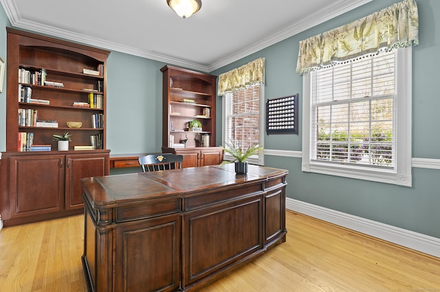home office featuring baseboards, ornamental molding, and light wood-style floors