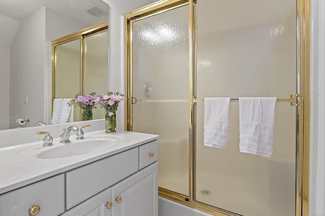full bath with an enclosed shower and vanity