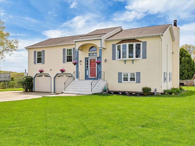 29 Washington Dr, Groton, CT 06340 - view of front of property with concrete driveway, a garage, a chimney, and a front lawn