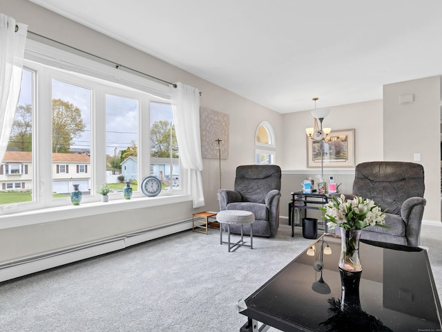 29 Washington Dr, Groton, CT 06340 - carpeted living area featuring a notable chandelier, baseboards, and baseboard heating