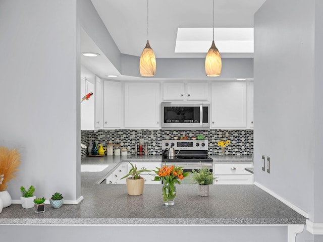 29 Washington Dr, Groton, CT 06340 - kitchen featuring backsplash, white cabinets, and appliances with stainless steel finishes