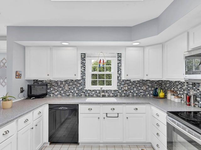29 Washington Dr, Groton, CT 06340 - kitchen with a sink, stainless steel microwave, white cabinets, dishwasher, and electric range