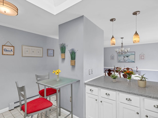 29 Washington Dr, Groton, CT 06340 - kitchen featuring a baseboard radiator, pendant lighting, ornamental molding, an inviting chandelier, and white cabinetry
