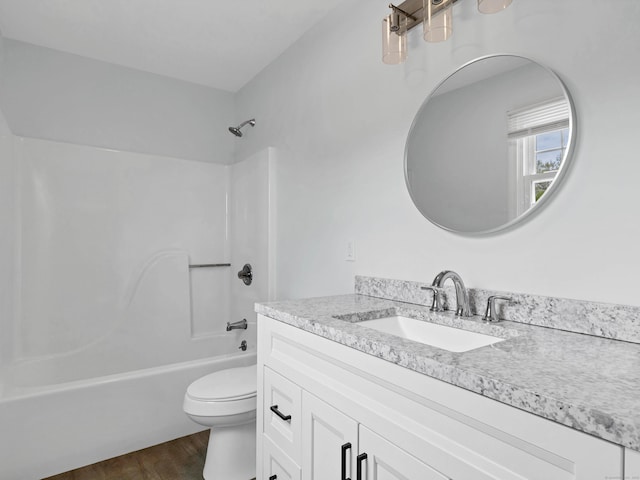 29 Washington Dr, Groton, CT 06340 - full bathroom featuring toilet, wood finished floors, vanity, and shower / bath combination